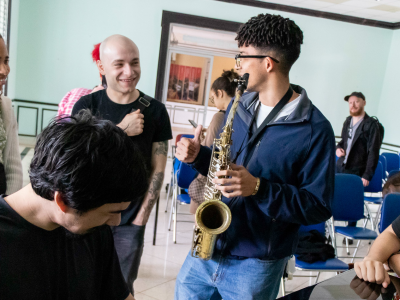 CUNY City College of New York students and Instituto Superior De Las Artes Students share a laugh during a jam session at the ISA Campus in Havana.