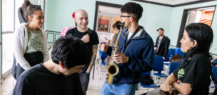 CUNY City College of New York students and Instituto Superior De Las Artes Students share a laugh during a jam session at the ISA Campus in Havana.